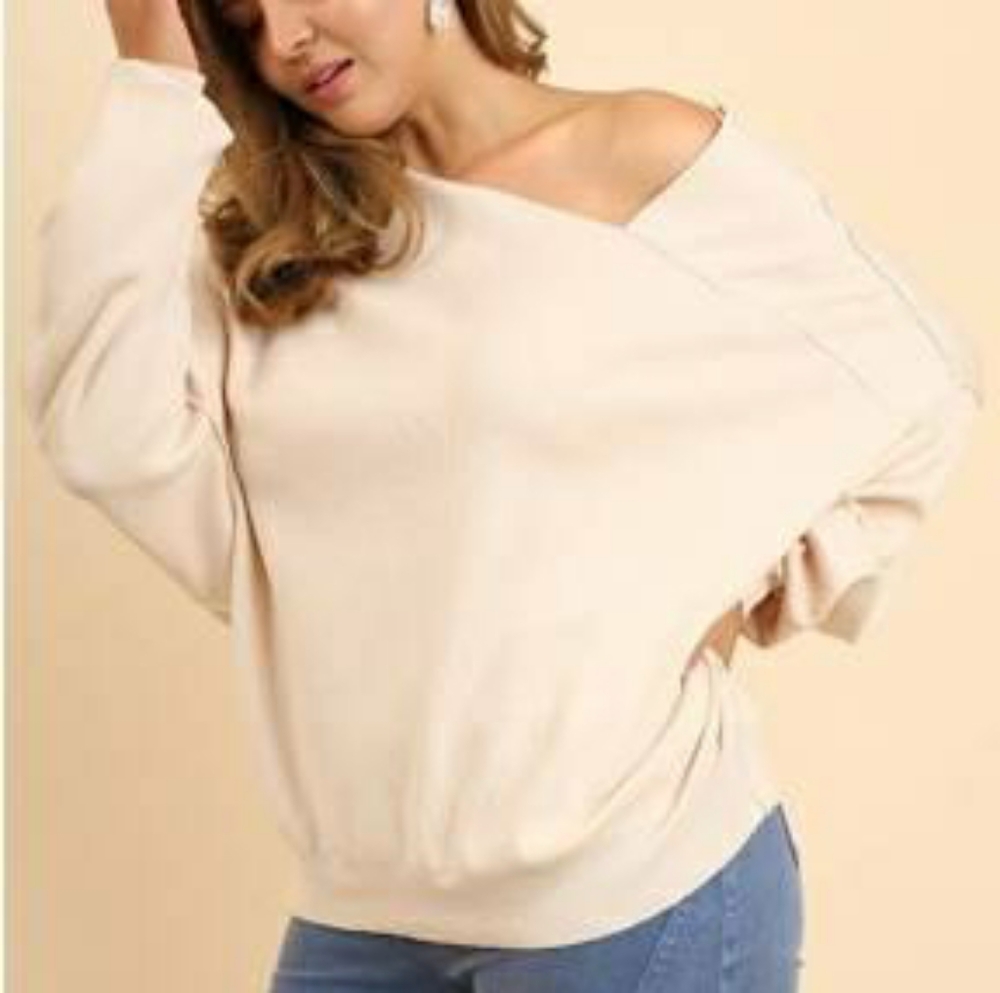 Free people asymmetric cream sweater.